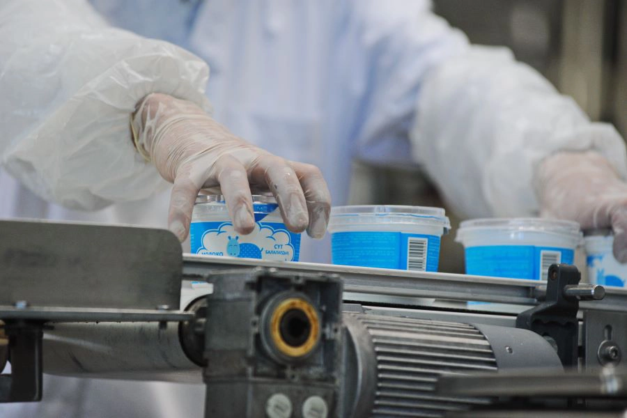 Worker in baby milk factory